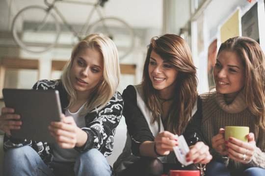 Women using digital tablet.