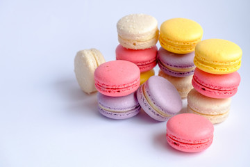Colorful traditional french desserts on white