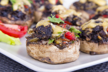 Stuffed champignons with eggs, cheese and paprika.