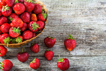 Fresh strawberries in the basket, fruits on farmer market table