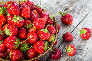 Fresh strawberries in the basket, fruits on farmer market table