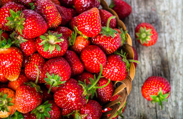 Fresh strawberries in the basket, fruits on farmer market table