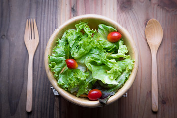 bowl of salad on wodden table