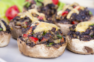 Stuffed champignons with eggs, cheese and paprika.