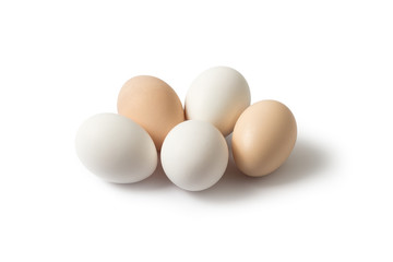 White and brown eggs on a white background