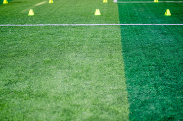 Obraz premium Artificial grass football field green close up