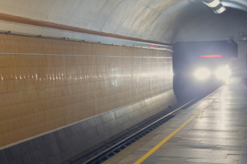 Approaching train is in the subway tunnel. Transport