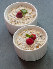 oatmeal with raspberries and honey, vertical, close up