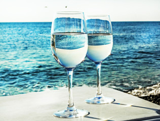 Two glasses of wine on beach
