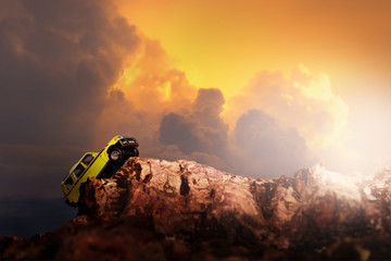 Four by four off road car crossing through the country road. Travel and racing concept for four wheel drive off road vehicle . © chokchaipoo