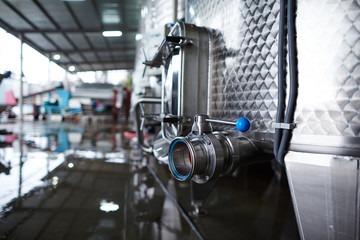 Close up of steel cistern in wine storage 