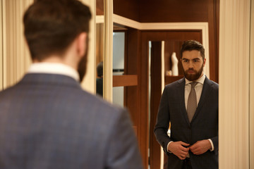 View from back of man looking at the mirror