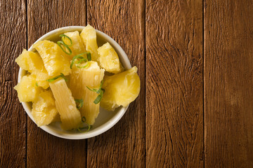 Manioc portion on the wood background