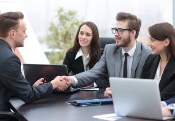Business people shaking hands, finishing up a meeting