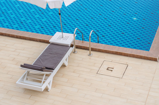 Chair and swimming pool in hotel