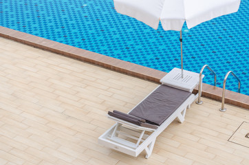 Chair and swimming pool in hotel