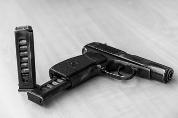 Military combat pistol in black and white