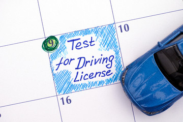 Reminder Test for Driving License in calendar with blue car