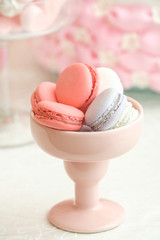 Colorful pink and grey macarons in cup