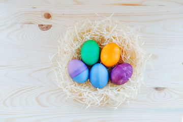 colored Easter eggs in nest