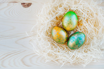 colored Easter eggs in nest