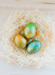 colored Easter eggs in nest