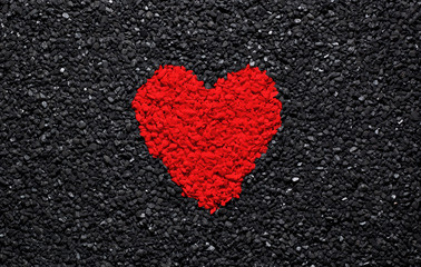 Obraz premium Red heart on the black background, stones, gravel and shingle, love wallpaper, valentine