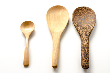 Wooden spoon and ladle on the white background