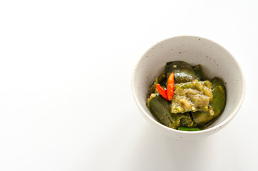 Fried eggplant with chili on white background