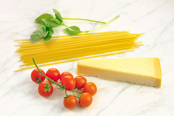 Basic pasta ingredients, including spaghetti and cheese