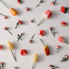 Creative minimal arrangement of colorful flowers. Spring concept. Flat lay.