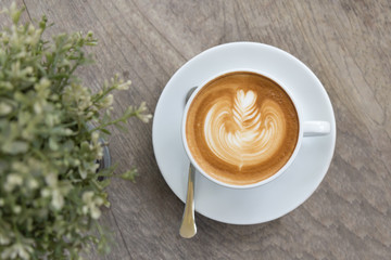 Latte coffee cup top view on wood table