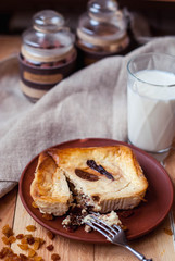 Cottage cheese casserole baked in the oven with figs and raisins and a glass of milk. Cheesecake for breakfast with a glass of milk.