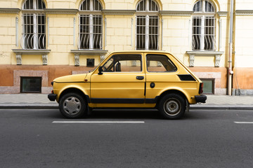 Fototapeta na wymiar Yellow car in Europe