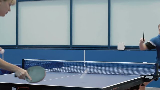 The couple masterfully playing a ping-pong