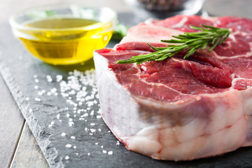 Raw meat on wooden background
