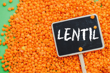 orange lentils and chalkboard with word 