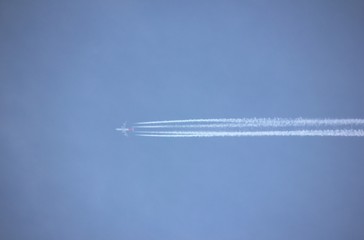 Plane with smoke trails