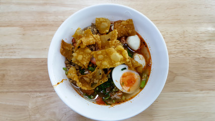 Hot and spicy instant noodle and fork on the table