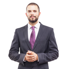 Handsome business man standing looking to the camera on white background