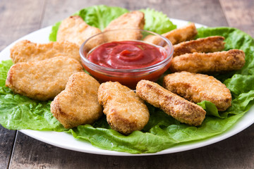 Fried chicken nuggets on wooden table
