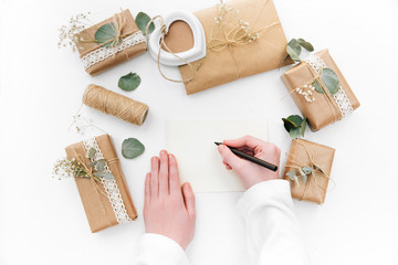 Hand writing invitation. Flat lay. Mothers day concept with handmade decorations 