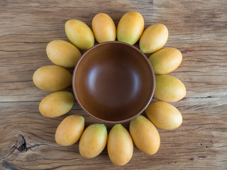 Sunflower shape made from marian plum and wooden bowl