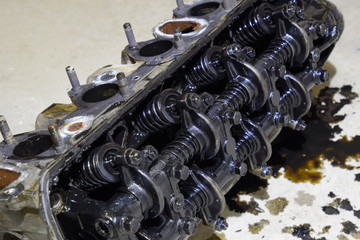 The head of the block of cylinders. The head of the block of cylinders removed from the engine for...