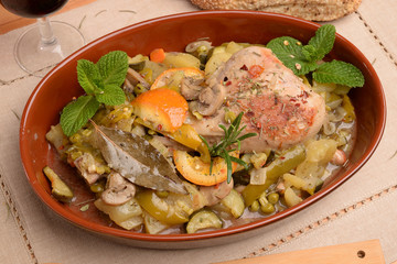 Terracotta with turkey thigh contour pepper potatoes and zucchini orange