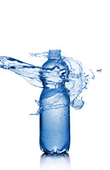 Splash in bottle of blue sparkling water