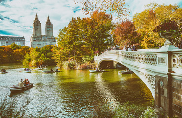 NEW YORK CITY - OCTOBER 2015: Tourists in Central Park enjoy foliage season. The city attracts 50 million people annually