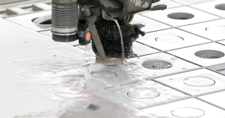 CNC Water-jet Machine at work cutting a steel plate. Detail.