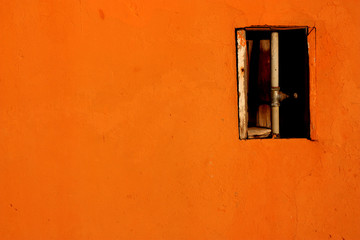 orange wall with water tube