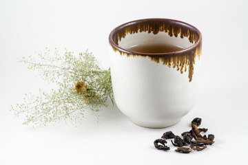 Chinese tea in tea cup and dried tea leaves
When sipping tea slowly, make feeling relaxed and happiness.
